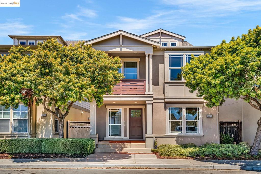 Nestled in the heart of Alameda’s coveted Grand Marina Village community, this elegant tri-level residence offers the perfect blend of refined living and charm. With 4 spacious bedrooms & 3.5 luxurious baths, this home welcomes you with a thoughtfully designed open floor plan, with the main level ideal for everyday comfort, seamlessly connecting the living, dining, and kitchen areas in a harmonious flow. The gracious primary suite is a true retreat—featuring a generous walk-in closet, serene balcony for morning coffee or evening reflections, and a spa-inspired bath complete with a soaking tub and separate glass-enclosed shower. Upstairs, a flexible top-level suite awaits—perfect for guests, extended family, or a tranquil home office or a fun play room. With its own bedroom, full bath, and living area, it offers privacy and versatility to suit your lifestyle. A dedicated laundry room adds everyday ease, while refined finishes and abundant natural light elevate the home’s inviting character. Enjoy peek-a-boo views of the glistening waterfront and marina, a daily reminder of the serenity and beauty just moments from your door. Set within a well-kept enclave near parks, cafes, and shoreline paths, this is Alameda living at its most graceful—welcoming, timeless, and quietly luxurious.