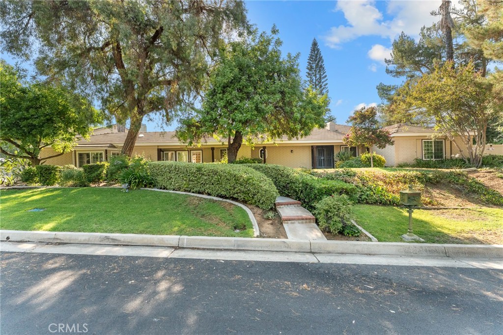 Spacious Single-Story Pool Home with Private Entry Bonus Suite in Prime South Redlands! This rare 3,700+ sq. ft. single-story home with a versatile layout and private-entry bonus suite is in one of South Redlands’ most desirable neighborhoods. Features 4–5 bedrooms, including a spacious primary suite with walk-in shower, sauna, and serene backyard and pool views. The living room, dining area, and family room connect seamlessly to the kitchen with granite counters and stainless-steel appliances. One wing offers two bedrooms, a full bath with dual sinks, and an office or optional fifth bedroom. The opposite wing hosts the private guest suite/bonus room with its own sitting area, bedroom, and full bath—ideal for guests or multi-generational living. An additional parcel behind the home provides exceptional privacy.