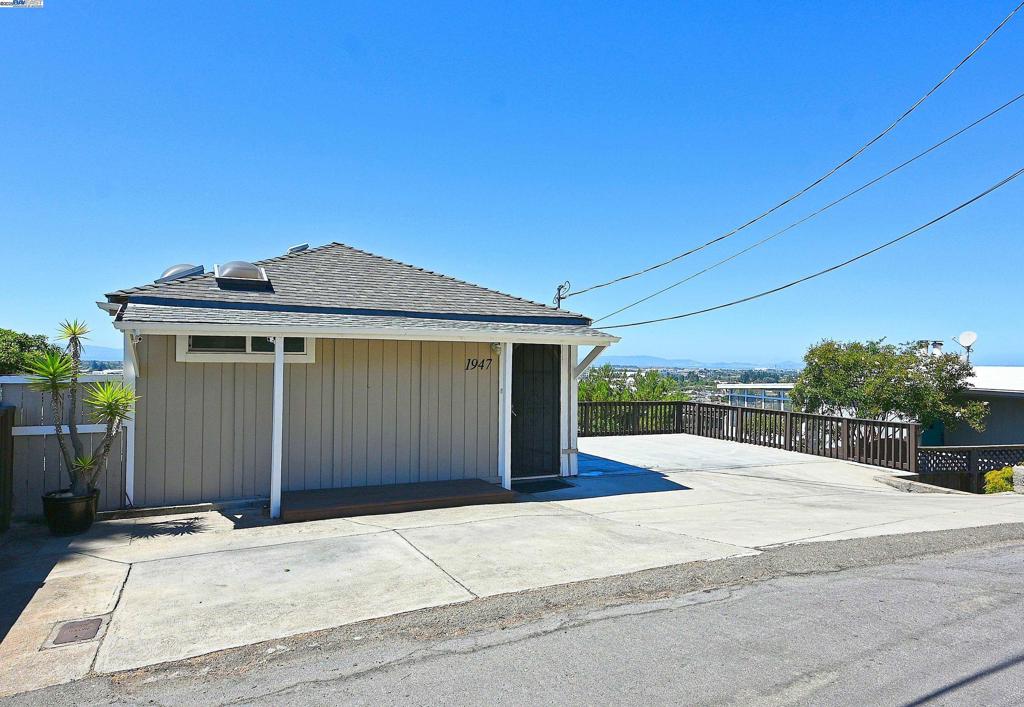 Perched in the San Leandro Hills, this charming 1-bedroom, 1-bath bungalow delivers million-dollar views without the million-dollar price tag. From your deck, take in sweeping panoramas of the San Francisco skyline, Bay Bridge, San Mateo Bridge, and Dumbarton Bridge—day or night, it’s a view you’ll never tire of. The panoramic views continue from the living room & updated kitchen. You can even soak in the updated bathroom's tub while enjoying the view! The home also features an office nook, along with 253 additional sq ft including laundry room, storage space & bonus/workout room. With the split zone AC/heat pump, you will be comfortable year round. Two decks and a terraced backyard offer multiple spaces to relax, entertain, and enjoy the scenery. Convenient off-street parking and a location close to commuter routes , Lake Chabot, Hillcrest Knolls Park, & BART. A rare combination of charm, affordability, and world-class views- step inside and be impressed! OPEN Sat. 8/23 & Sun. 8/24 from 1PM-4PM. Views: Downtown
