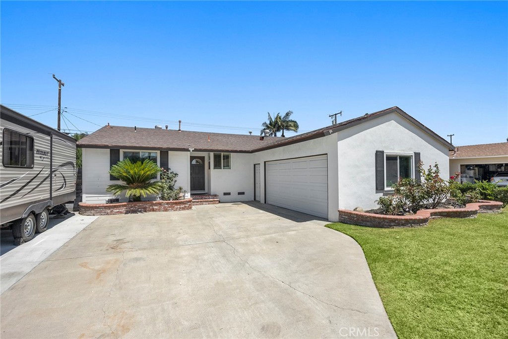 Welcome to 719 W. Roberta Avenue- a well maintained 4 bedroom 2 bathroom single-story home. Sitting on a 6,386 sq ft lot, this home offers 1228 sq ft of comfortable living space, RV parking (w/hookups) and several thoughtful upgrades that makes this home move in ready. Step inside to an open floor plan and a functional kitchen with ample cabinetry and counter space-perfect for family meals.
The home features central air conditioning and a whole house fan to keep you comfortable year-round. All four bedrooms offer flexibility for a growing family, home office or guest space. The primary suite offers a fireplace, doors out to the backyard and its own en-suite bathroom for added privacy.
Outdoors, you will find a large backyard ideal for relaxing, gardening or hosting get-togethers. The RV parking provides added value and convenience for recreational vehicles or extra storage. The attached two-car garage and extended driveway offer plenty of parking.
Located in central Fullerton near schools, parks, shopping, dining, and easy freeway access (91,5, and 57).