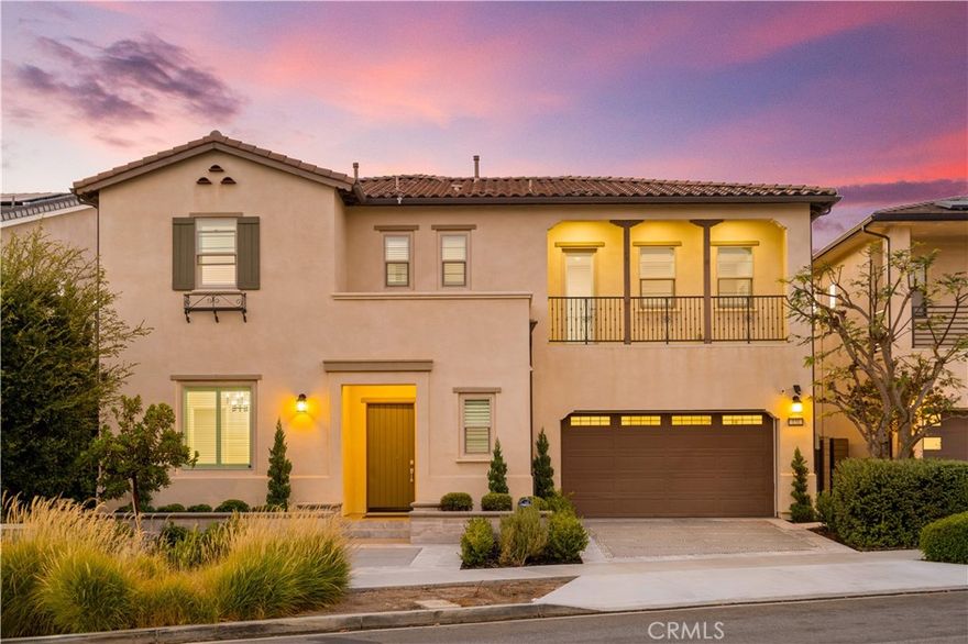 FORMER MODEL HOME at Great Park with over $700K in upgrades situated on an extra-large 7,843 sqft premium lot — a rare find. Upon arrival, the Spanish-inspired architecture and landscaping set the stage for elegance. Step inside to a dramatic two-story foyer with a curved staircase, leading to a spacious open floor plan filled with natural light. The chef’s dream kitchen features Wolf appliances and an extraordinary wall of four Sub-Zero units, quartz countertops, and an oversized island, custom backsplash, large walk-in pantry, seamlessly connected to the great room and California Room. Guest powder rooms on both levels, 5 bedrooms total, all bedrooms have an en-suite bathroom including desirable 1st floor guest suite. The original courtyard was transformed into a versatile lifestyle lounge with wood-plastic composite decking, and a modern fireplace. Upstairs, the primary suite retreat offers coffered ceilings, a spa-inspired bathroom with dual vanities, soaking tub, and a private balcony overlooking the backyard. Three secondary bedrooms and a generous loft provide comfort and flexibility.The 3-car garage and oversized mud room provide exceptional practicality. The resort-style backyard is a showstopper: a custom glass canopy with lighting, built-in BBQ,  fireplace with TV, and triple water feature, perfect for entertaining. Located in the vibrant Great Park Neighborhoods, residents enjoy award-winning Irvine schools (Cadence Park K-8, Portola High), community pools, parks, and trails — all just minutes from shopping, dining, and freeways.