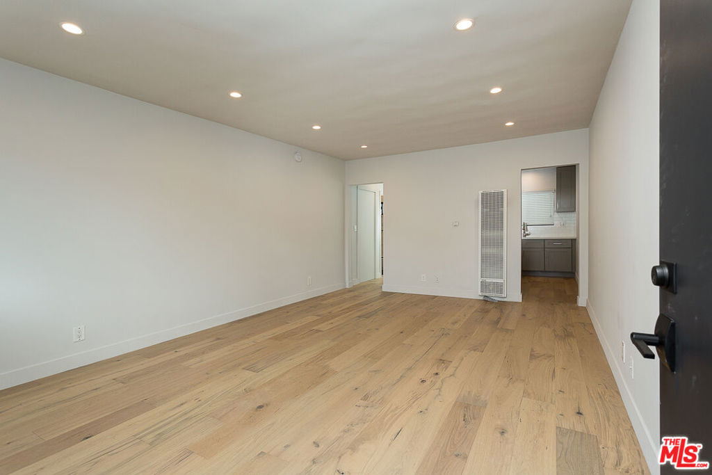 BACHELOR UNIT - ALL UTILITIES INCLUDED. Very nice building that has undergone a recent major renovation. The actual unit itself is a bachelor with new flooring, recessed lights, windows, doors, kitchenette, stainless fridge, stove top and microwave. There is no "full kitchen". Landlord pays for trash, water, electricity, and gas. Great location, beautiful cozy bachelor apartment! Must see to appreciate. Pictures in listing are of a similar unit in the building. AGAIN, THIS UNIT HAS NO KITCHEN SINK. ALSO NO PARKING. OWNER PAYS FOR WATER, TRASH, GAS, ELECTRICITY AND LANDSCAPING.