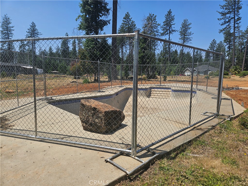 Swimming pool, opportunity awaits. Come check out this .35 acre lot located in the charming Town of Paradise California. The lot features an existing in-ground pool, ready to be restored to its former sparkling beauty, some pg&e fill dirt, and partial neighboring fencing. According to public records, the previous home footprint was approximately 1,500 sq. ft., PID is active, septic report is available. Close drive to Lake Oroville/Lime Saddle marina, with hiking trails, fishing, camping and many other outdoor recreational amenities to choose from. Buyer to verify all information to their satisfaction.