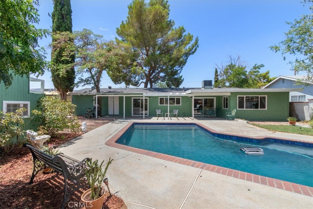 Welcome to this beautifully updated single story 3 bedroom 2 bath home featuring a large pool in the heart of the highly desirable Quartz Hill community. Located in one of the best school districts in the AV. Situated on a generous third of an acre lot. This1,980 sqft home offers a perfect mix of comfort, style, and functionality, Freshly painted inside and out. Brand new windows throughout the entire property. The gorgeous kitchen is a standout with rich cherry cabinets, granite counter tops, plus granite backsplash and windowsill that over looks the pool. Kitchen has recessed lighting, bamboo hard wood floors run through the living room, dining room, hallway, and large bedroom. The living room also boasts a cozy wood- burning fireplace, while the family room stands out with a custom fabric accent wall and more recessed lighting. The full bath has a relaxing jacuzzi tub. Four rooms offer views of the pool and the open space backyard. Recently painted playhouse in backyard as well as two generous sheds that are each 10 x12 and one with loft. Pressed concrete driveway and six fool pool fence. This is a very well take care of property with pride of ownership of over 20 years throughout.
