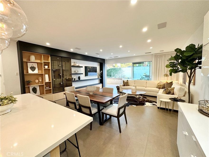 Stunning Smart Home with Designer Finishes and Luxury Features.

Welcome to this exceptional smart home in West Hills—perfect for homeowners and investors alike. Outfitted with fully paid solar panels, this property offers major savings on electricity bills while supporting a more sustainable lifestyle.

Situated in a prime location just minutes from Warner Center, the 101 Freeway, The Village at Topanga, Westfield Topanga, The Commons at Calabasas, and El Camino Shopping Center, this home truly has it all.

The main residence spans 2,074 sq. ft. and features 4 bedrooms and 3.5 bathrooms. The open-concept layout is filled with natural light and offers ample storage, recessed lighting, and tile flooring, with laminate flooring in the bedrooms. Custom doors, closets, and kitchen cabinetry enhance the home’s upscale appeal.

The gourmet kitchen is equipped with high-end appliances, a mini refrigerator, a spacious quartz island, and a large walk-in pantry—ideal for both everyday living and entertaining. The open family room boasts a custom-built entertainment center and sliding glass doors that lead to the backyard for seamless indoor-outdoor living.

The expansive primary suite includes a walk-in closet and a spa-like bathroom with a large shower and sliding glass doors opening to the backyard.

Designed for entertaining, the backyard features a generous patio with a gas fire pit, hanging gas heaters, a turf lawn, and fruit tree planters. The impressive outdoor kitchen includes an oversized bar with a pizza oven, built-in refrigerator, gas burner, and sink.

Additional highlights include security cameras, a fully enclosed gated front yard, and a washer and dryer included in the sale.

The property also offers a fully permitted 441 sq. ft. Accessory Dwelling Unit (ADU) with its own private entrance and address. The ADU includes vaulted ceilings, recessed lighting, and a full-sized kitchen with all appliances, and its own full bathroom—perfect for guests, extended family, or rental income.

This home is truly a must-see to fully appreciate its beauty, comfort, and functionality.