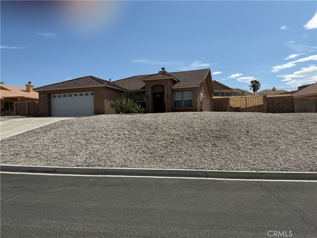 This Great Home located in Copper Hills track. Next to Sky Harbor Area, has 4 bedrooms and 2 baths . Fourth bedroom could be an Office or den. You enter into the living room with a fireplace, renters have a TV in front of it. Dining area is off of a spacious kitchen, with a walk in pantry. Stove is newer, with a microwave above. Vinyl wood flooring in living room and master bedroom. Spacious master bedroom with slider to backyard. Covered Patio in backyard. Home has natural gas and central air. Great neighborhood! Close to Joshua Springs private school and church. About 15 minutes to Joshua Tree National Park. Close to the famous Pioneer Town! A little over an hour to Big Bear if you love skiing. Palm Springs is about 30 minutes away. Dog Park a couple minutes. Home is currently on septic, sewer should be coming around the spring of next year, Home is well taken care of. Hurry up it wont last long!