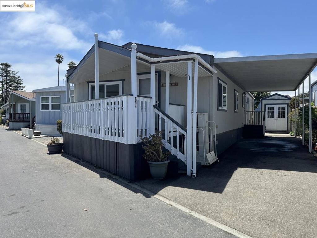 This two-bedroom, two-bathroom mobile home is located in the sought after Shoreline Mobile Estates, a 55+ MHP in Live Oak. The property offers approximately 1040 square feet of living space. The higher ceilings and skylights allow for a light and bright interior. The home features many updates including remodeled kitchen with granite countertops and stainless appliances. Residents can enjoy the convenience of being close to the beach as well as nearby shopping and various amenities. A detached, electrified shed/storage room provides additional space for storage or hobbies. The community offers an on-site pool, providing an opportunity to do some laps or just enjoy the outdoors. There are also 3 Community Clubhouses and area designated for washing vehicles. Whether you're downsizing or dreaming of a beach town getaway, this one checks all the boxes!