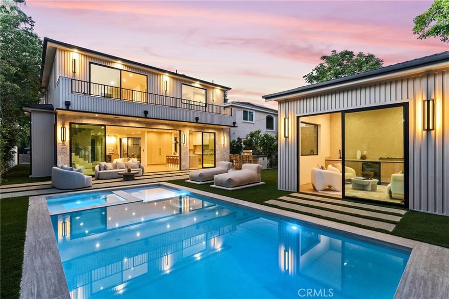 Welcome to this exceptional newly built 2025 gated estate, crafted by one of Sherman Oaks’ most acclaimed builders and designers, renowned for their visionary architecture, superior craftsmanship, and sophisticated blend of high-end materials.Situated on a serene street lined with luxury homes, just moments from Ventura Boulevard, this stunning residence sets a new standard for luxury living. Designed with both comfort and elegance in mind, the main house features 5 beds & 5.5 bathrooms, including a detached guest house. The open-concept floor plan is ideal for modern living, featuring wide-plank golden oak flooring, warm Venetian plaster walls, & expansive floor-to-ceiling windows flood the space with natural light. A dramatic family room with a sleek custom fireplace, & oversized pocket sliding doors that open to the backyard oasis. The designer chef’s kitchen is a true centerpiece, featuring custom cabinetry, high-end appliances, porcelain countertops, and a statement island with integrated stone sink & premium fixtures, blending functionality with artistry.The formal dining room is elevated by a statement wall & a designed wall wine holder adds a bold touch of sophistication and convenience for entertainers. The first-floor ensuite is perfectly positioned for use as a home office, wellness or guest room. A dramatic powder room with a floating stone sink adds a bold design element. Upstairs, soaring ceilings frame three generously sized ensuite bedrooms, shared front balcony and all with access to an oversized patio. The primary suite is a luxurious retreat, with a stunning fireplace, a designer wall finished in custom textured Venetian plaster infused with relaxing Tulum-inspired vibes, custom built-ins, a walk-in closet, and a private balcony. The spa-like bathroom boasts a soaking tub, dual rainfall showers & vanities. Step outside to a resort-style backyard with lush landscaping, a sparkling pool & spa, outdoor kitchen with b.b.q,  a detached enclosed cabana equipped with a full bathroom & a kitchenette designed for guests, an office/pool house and effortless entertaining & relaxation. The Crestron smart home is equipped with built-in speakers, security cameras, and ambient LED lighting throughout. Located in a highly sought-after Sherman Oaks neighborhood, easy access to the area's best shops, dining, Kester magnet school and the 101 & 405 freeways. Own this rare opportunity, a one-of-a-kind 2025home that perfectly embodies both luxury & lifestyle.