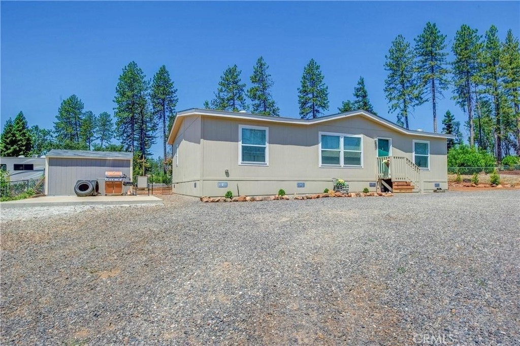 Welcome to this beautiful property with a circle driveway, situated in a great location. This three-bedroom, two-bath Manufactured home offers an array of desirable features that are sure to impress. The home features a center island in the kitchen with elegant granite counters creating a sleek and modern ambiance. The planked flooring throughout the house adds a touch of durability making maintenance a breeze. Master bedroom has its own master bath with walk in shower. There is a separate laundry room with an entrance into the fenced back yard. Outside we have a storage shed allowing you to keep your belongings organized and neatly tucked away. Additionally, the newly planted fruit trees add a delightful touch to the landscape. There is a concrete pad for RV parking or future garage. No matter the season, you'll enjoy optimal comfort with the central heat and air system, providing ideal temperatures throughout the year. Don't miss the opportunity to call this property your home, with its combination of desirable features, convenient location, and comfortable living spaces. Schedule a viewing today and experience the allure of this remarkable property firsthand.