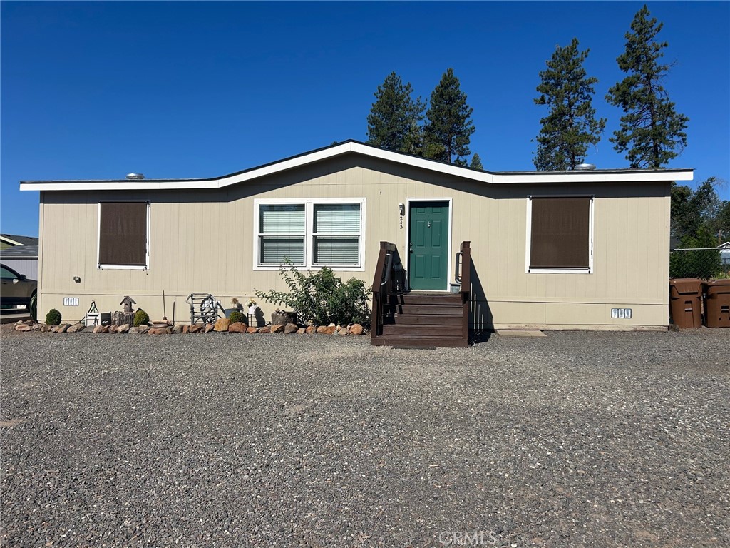 Welcome to this beautiful property with a circle driveway, situated in a great location. This three-bedroom, two-bath Manufactured home offers an array of desirable features that are sure to impress. The home features a center island in the kitchen with elegant granite counters creating a sleek and modern ambiance. The planked flooring throughout the house adds a touch of durability making maintenance a breeze. Master bedroom has its own master bath with walk in shower. There is a separate laundry room with an entrance into the fenced back yard. Outside we have a storage shed allowing you to keep your belongings organized and neatly tucked away. Additionally, the newly planted fruit trees add a delightful touch to the landscape. There is a concrete pad for RV parking or future garage. No matter the season, you'll enjoy optimal comfort with the central heat and air system, providing ideal temperatures throughout the year. Don't miss the opportunity to call this property your home, with its combination of desirable features, convenient location, and comfortable living spaces. Schedule a viewing today and experience the allure of this remarkable property firsthand.