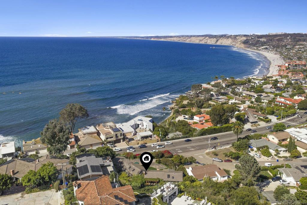 Stunning, far-reaching views of the Pacific, La Jolla Shores, and northern coastline are found in this welcoming and light-filled single-level home in La Jolla. Beautifully maintained indoors and out, with views from nearly every room, this beloved home offers multiple fireplaces, an eat-in galley kitchen, step-down family room with terrace, and abundant storage. Pitched wood slat ceilings add volume to living spaces without sacrificing the home’s inviting aura. The picture-perfect and lush backyard is bordered by mature greenery, a grassy lawn, patio and trellis and offers both privacy and views through to the Pacific. Timeless in design and blessed with spectacular views, the home also features easy access to the Village, beaches and freeways. Enter driveway off Amalfi Street.