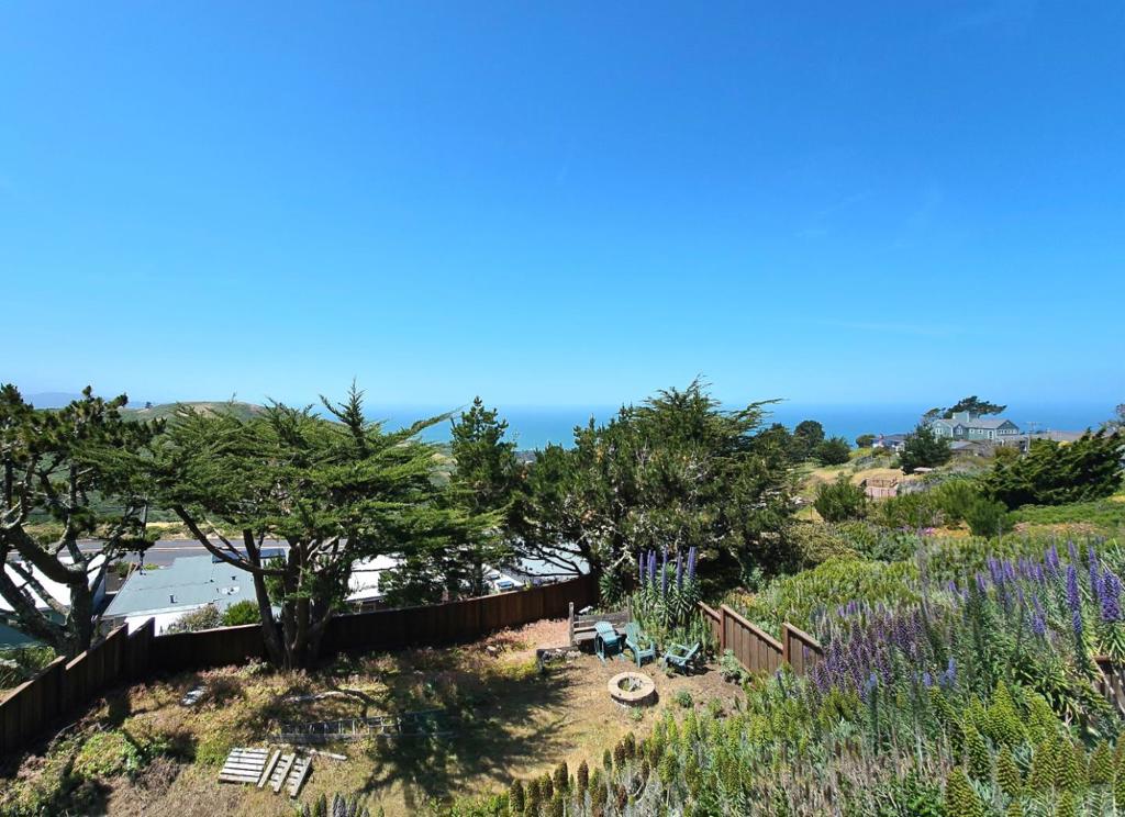 COZY,, CHARMING HOME ON A HILLTOP WITH PANORAMIC VIEWS OF THE HILLS AND THE OCEAN! REMODELED. MOVE-IN CONDITION!!!! Ranch style home on a large 6,169 sq. ft. lot! LIKE NEW!!! Tastefully remodeled in 2021 - new roof, kitchen, bathroom, hardwood floor, tankless water heater. The 3rd bedroom off the living area is versatile - it could be used as a formal dining room, family room or office. Fireplace in the living room adds a touch of warmth and ambiance The open kitchen features a breakfast bar, Shaker cabinets, quartz countertops and a French door stainless refrigerator making it perfect for culinary enthusiasts. Enjoy memorable gatherings with family and friends outdoors on the spacious and inviting deck looking out to the tranquil views!!! Laundry hook-ups in garage. Backyard shed provides extra storage space. Tons of potential - perhaps an ADU? or create an amazing garden - your own organic vegetables, colorful flowers and fruit trees! Conveniently located - minutes to the beach,shops and restaurants; a stone's throw to Skyline Blvd and Westborough Blvd to get to 280.