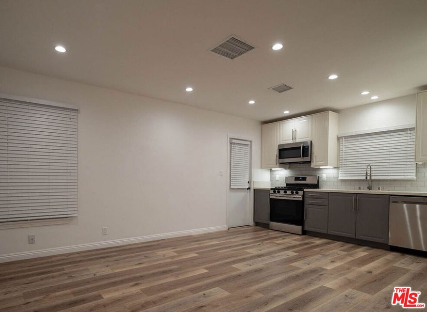 Stylish, modern, and completely remodeled, this private rear unit of a quiet triplex is located in a peaceful single-family neighborhood just one block from Veterans Memorial Park. Thoughtfully updated with contemporary finishes, the home features central air conditioning, in-unit laundry, and sleek stainless steel appliances. Enjoy direct access to a shared backyard, perfect for relaxing or entertaining. Garage parking is currently included; however, availability is subject to change. Ample street parking available right in front. Nestled in a prime location near shops, restaurants, and downtown Culver City, this move-in-ready space offers comfort, convenience, and privacy. Water, trash, and sewage are covered by the owner.