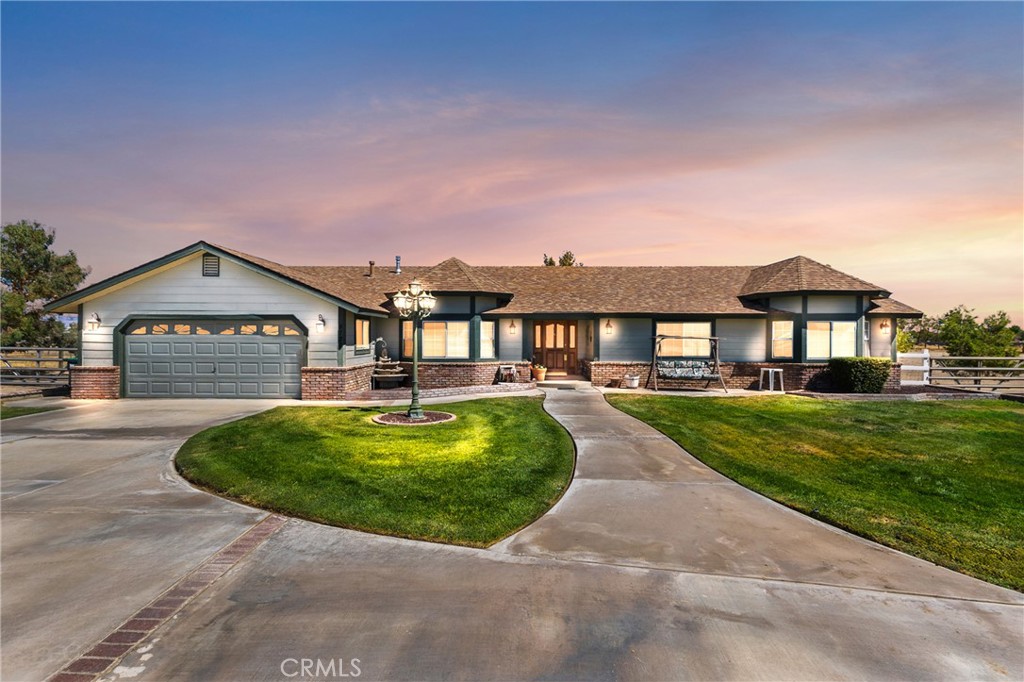 Spacious Antelope Acres Retreat on 5 Acres with Workshop, Horse Facilities & Pool!!
Welcome to your private desert retreat! Situated on 5.01 fully fenced acres in peaceful Antelope Acres, this 3-bedroom, 3-bathroom home offers 2,221 sq. ft. of living space with modern upgrades, a versatile workshop, and extensive outdoor amenities designed for comfort, convenience, and country living.
Inside, the open kitchen is a chef’s delight, featuring oak cabinetry, granite countertops, tiled backsplash, a farmhouse sink, and a gas range. A breakfast bar, built-in china cabinet, and desk area add both charm and functionality. Just off the kitchen, the large laundry/mudroom includes abundant storage, a pantry, sink, and an adjacent full bathroom with an oversized tiled shower.
The living areas are designed for relaxation and entertaining. A cozy family room centers around a large brick-hearth fireplace with a pellet stove insert, while the living room’s bay windows flood the space with natural light. The hall bathroom offers dual sinks and an updated tub/shower combo. All bedrooms are generously sized with ceiling fans, mirrored closets in the secondary bedrooms, and a primary suite featuring a walk-in closet and private bath. Warm oak doors and accents throughout adds timeless character.
Outside, the property is a dream for both recreation and work. The backyard retreat includes an above-ground pool, spa, kids’ play area, and a garden for homegrown produce. Horse lovers will appreciate the corrals with shaders, a tack/tool shed, and an equipment storage barn.
The true showpiece is the 40x60 workshop, equipped with skylights, 220V electric, a wood stove, air compressor, and electric roll-up doors—offering endless possibilities for hobbies, business use, or storage. For travelers, there’s a convenient RV hookup and dump station.
Practical upgrades include a newer HVAC system plus a swamp cooler for energy-efficient comfort, and the property is served by a mutual water company. With block wall fenced private back yard and wide-open views, this estate blends privacy, function, and the beauty of desert living.
Whether you’re looking for space for your animals, room to work on projects, or simply a quiet place to unwind under the stars, this Antelope Acres property offers it all. Don’t miss the opportunity to own a home that combines modern living with the freedom of wide-open space.