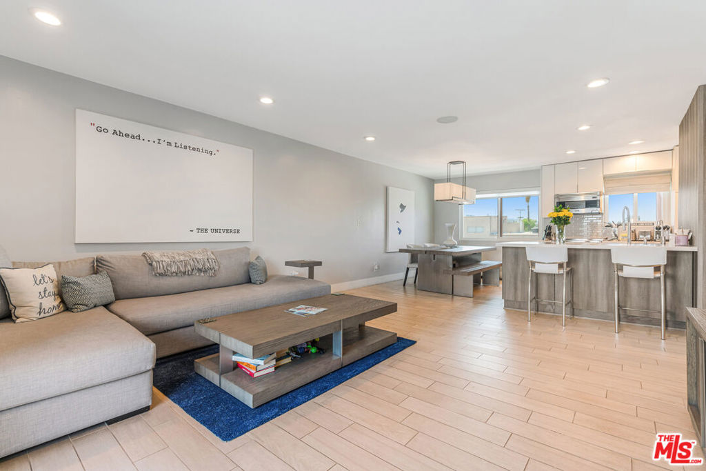 MODERN LUXURY AT IT'S FINEST Pied-a-Terre? Private Getaway? Luxury Tiny Home? Lock-it and Rocket? This swanky and airy 1Bed+1.5 Bath Condo is all that, and more! Located one block from Ventura in an open mid-century building with pool and gated garage, this unit is ideally perched on the top floor in an ultra quiet rear corner with easterly views. No detail or expense spared on this Penthouse SmartHome. Completely remodeled with designer finishes, including; Control-4/Sonos/Lutron/Nestsystems, Kraftmade wood cabinetry, Viking and Bosch appliances, low maintenance tile & engineered flooring, and custom closet built-ins. The open-plan layout feels much larger than its footprint, and dances with natural light flooding in from every window and serene views of LA palms, city lights and the mountains beyond. Tall sliders lead to an expansive balcony, perfect for barbecue & al fresco dining. This is a small home with a big heart. Come live a life that dances from the bright sunrise straight thru the idyllic moon-lit nights.