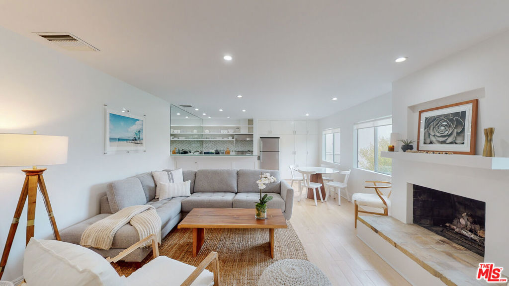 Step into coastal elegance with this sun-drenched, designer-remodeled one-bedroom, one-bathroom condo, ideally located on the sands of Malibu's coveted Carbon Beach. This top-floor residence boasts breathtaking natural light, open-sky views, and a seamless blend of modern luxury and coastal charm.The brand-new gourmet kitchen is a chef's dream, featuring high-end stainless steel appliances, a Thermador professional-grade stove, a Viking hood, and a dedicated wine refrigerator. The newly designed bathroom showcases stylish tilework and premium fixtures, while the custom-designed master closet offers exceptional storage solutions. Gorgeous hickory whitewashed hardwood floors extend throughout the space, complementing the warmth of a gas fireplace. Additional floor-to-ceiling built-in storage adds both functionality and sophistication.The complex itself is a private oasis, complete with an ocean-facing heated pool, communal BBQ areas, a newly remodeled lobby, an elevator, and secure gated entry. Enjoy direct beach access, covered garage parking, and effortless proximity to Malibu's finest restaurants, high-end boutiques, a health club, a movie theater, grocery stores, and the iconic Malibu Pier.Surrounded by multi-million-dollar oceanfront estates and lush landscaping, this exclusive retreat offers a rare opportunity to experience the best of Malibu beachfront living. Designer furniture may be available for purchase.Don't miss your chance to own a piece of paradise on Billionaire's Beach!