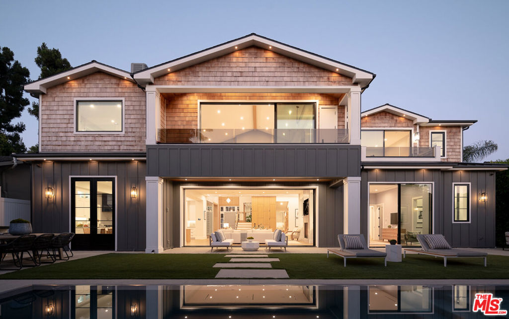 Nestled at the intersection of Pacific Palisades and Brentwood Park, emerges a vision of luxury and sophistication. Crafted with exceptional design and meticulous attention to detail, this masterpiece of modern elegance boasts 7 en-suite bedrooms and 2 powder rooms.Designed to effortlessly host memorable family gatherings and elegant soires, the open-plan layout is bathed in natural light, seamlessly integrating indoor and outdoor living spaces. The expansive kitchen features unique Viking Tuscany appliances, custom cabinetry, and a spacious butler's pantry.The outdoor area is an entertainer's dream, with an inviting edgeless swimming pool, a cabana, and a full shower. The al fresco setup encourages outdoor living, perfect for hosting summer parties or relaxing in the California sun. Inside, a state-of-the-art movie room provides additional entertainment options for the entire family.Modern amenities include a Creston Home system for enhanced security and convenience, automated shades in the common living areas, an elevator, theater room, wine storage, 3-car garage, and safes in the primary suite and lower basement. Located within an award-winning school district, this home offers an unparalleled lifestyle. Every detail of this property has been thoughtfully curated to create a living experience that is both luxurious and comfortable.