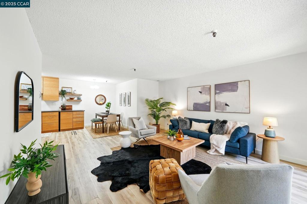 Welcome to 325 Lenox Ave. #104 in the desirable Adams Point neighborhood! This condo is a 1-bedroom, 1-bathroom condo, perfectly situated just one block from the Fairyland side of Lake Merritt, two blocks to Whole Foods, and a short stroll to an array of restaurants, cafés, and shopping. Inside, enjoy modern touches including stainless steel appliances, luxury vinyl plank flooring, and an open living space that seamlessly flows to your own private outdoor patio—perfect for morning coffee or evening relaxation. With a convenient side entrance, access to this first-floor unit requires only one easy stair-step. Additional amenities include one secured parking space in the gated garage. Whether you're looking for an urban retreat or a place to call home in one of Oakland's most desirable neighborhoods, this condo offers it all—location, convenience, and comfort!