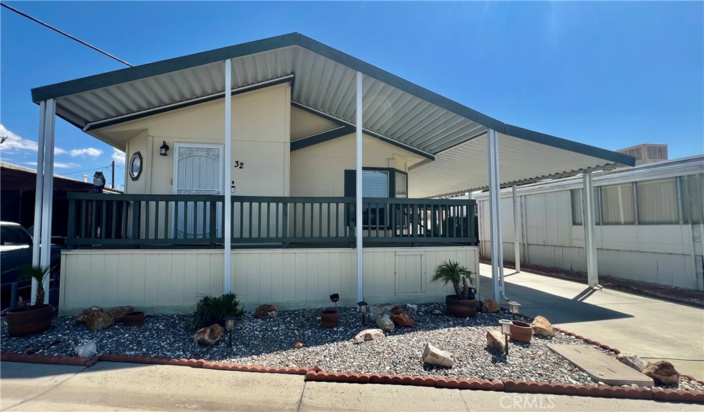 Desired 55+ Scenic, Community of Rancho De Anza. This 2005 beautiful 3 bedroom, 2 Bath, Manufactured Home is MOVE IN READY. All DUAL PANE WINDOWS. STAINLESS STEEL APPLIANCES including a REFRIGERATOR, MICROWAVE, DISHWASHER. Laminate Wood flooring for ease of cleaning. Kitchen open to living room & dining room with breakfast bar. Indoor laundry room (WASHER & DRYER INCLUDED) and extra built-in cabinetry and direct covered carport access. Huge master bedroom with ceiling fan and wardrobe closet. Master bathroom with vanity sink, step in shower stall & large soaking tub. Two nice size guest bedrooms with wardrobe closets. Guest bathroom has shower/tub combo. This is a low maintenance manufactured home for years to come. Enjoy your morning or afternoon beverage from your front porch with incredible views of the mountains. Large storage shed and separate area with table & chairs & a double swing great area for entertaining. Park offers Swimming Pool, Jacuzzi. Billiards and a Clubhouse. Nice peaceful, quiet Park. Retirement at its finest!