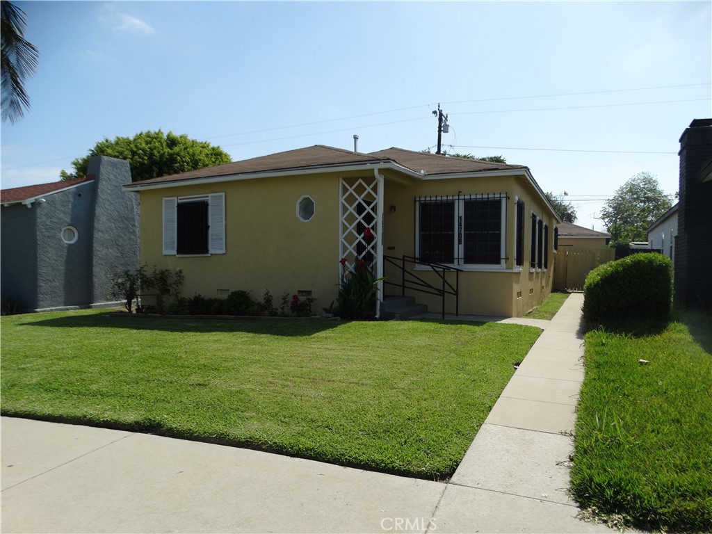 Beautiful East Compton home nestled in a sought-after neighborhood. This property offers 4 bedrooms and 2 bathrooms, central air conditioning, featuring a generous living room that flows seamlessly into the adjacent dining area with an open and inviting floor plan. The updated kitchen boasts newer cabinets and stylish stone countertops. The expansive backyard is ideal for entertaining, complete with a covered patio/carport and a detached two-car garage with convenient alley access.