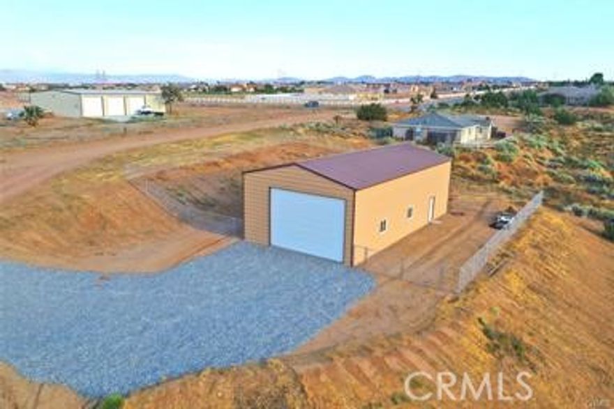 ***GARAGE FOR SALE***Sits on over 2 acres of land**POWER**SEPTIC***60x30 (1800 SF) ***20' Wide with 14' High Doors**The shop area is fenced***Container stays***Washer/Dryer hook ups***