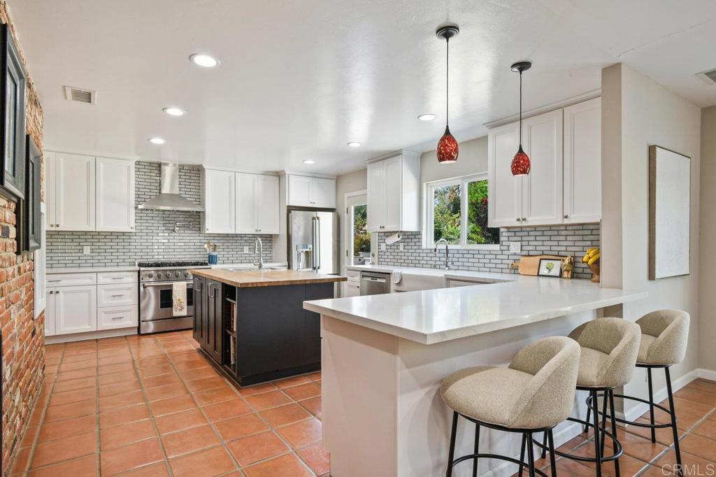 A private one-of-a-kind Horizon Hills gem! This gated ranch-style home spans 2,676 sq ft and features 4 spacious bedrooms and 3 bathrooms, offering a thoughtfully designed layout ideal for both everyday living and hosting guests. A large light-filled, updated kitchen opens to the incredible backyard gardens and patio entertaining. Outside, immerse yourself in vibrant blooming flower gardens and walking trails that have been professionally landscaped. The backyard is an entertainer’s dream—complete with a sparkling pool with lounge chairs and bubblers, a huge covered patio, built-in grill, bar area, and outdoor fireplace—perfect for evening gatherings or relaxing weekends. The yard also includes, planter boxes, potting shed, chicken coop, citrus orchard and plenty of opportuunity and space to build a future ADU. A large oversized 2-car garage offers ample storage, workshop area and includes its own half bathroom—a rare and convenient bonus. Solar is a 5kW in size, power purchase agreement, and a newer upgraded septic system. This unique property offers privacy, space, and comfort in one of the area's most desirable neighborhoods, close to schools, shopping and more.