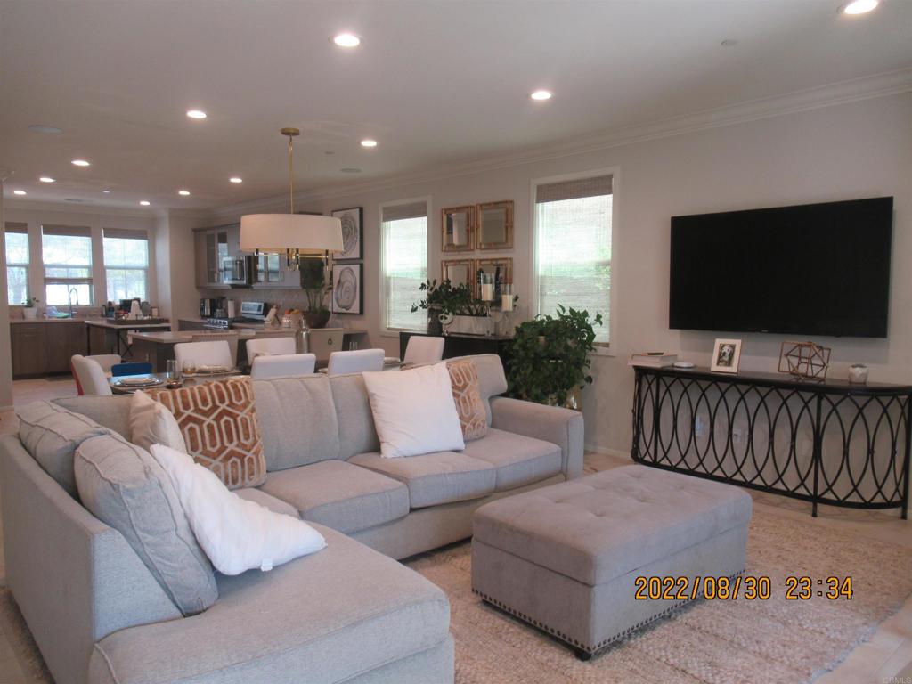 Former Model Home across the street from the Harvest Wellness Center, a private community club gym to use, pool, recreation area, gym just steps from the center. FULLY FURNISHED HOME. 4 bedroom highly upgraded home, indoor laundry room with washer and dryer included, upgraded kitchen with island and refrigerator included. One bedroom and full bathroom on the first floor. Loft/family room on the second floor. Large main bedroom and walk in closets with 2 other bedrooms on the second floor. Attached 2 car garage, private backyard and lush landscaping, landscaping service is included. Quick access to shopping, freeway, new development, new restaurants. Professionally decorated and some items to stay on request.
