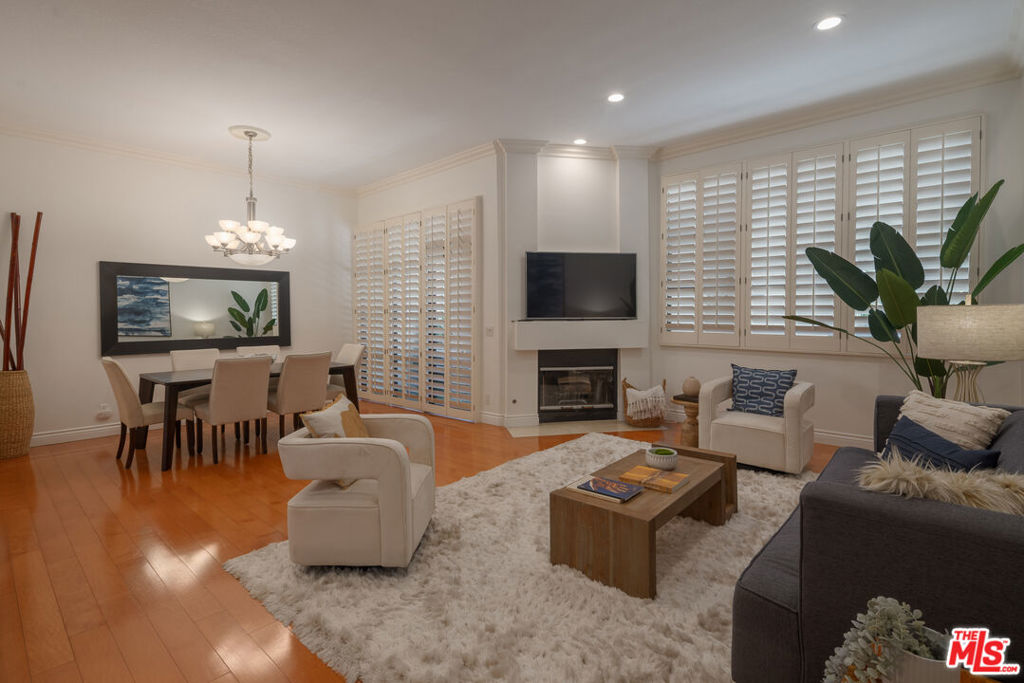 Freshly Staged & Full of Light A Brentwood Gem on Prime Montana Ave. Just moments from San Vicente in the heart of Brentwood, this beautifully refreshed and newly staged 2 bed, 2.5 bath townhome-style condo offers the perfect blend of space, style, and location. Set in a quiet, highly desirable building on one of the most charming stretches of Montana Ave, the home welcomes you with soaring ceilings, travertine floors, and an abundance of natural light.The expansive living area features a fireplace and wet bar perfect for entertaining while a flexible upstairs loft is ideal as a home office or cozy reading nook. The oversized primary suite includes a second fireplace, walk-in closet, and a spa-inspired bath with skylights overhead. Other highlights include two side-by-side parking spaces, extra storage, 11 guest parking spaces, and access to a sparkling pool surrounded by manicured grounds. With fresh interiors and sophisticated staging, this special Brentwood condo shows beautifully and is ready to be seen.