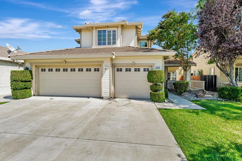 Welcome to 1586 Arrigotti Lane, a beautifully maintained 5-bedroom, 3-bathroom home in Tracys desirable Meadowood neighborhood. This spacious residence features two generous living areas and a full bedroom and bathroom on the main level, ideal for guests or multi-gen living. Upstairs, you'll find four additional bedrooms, including a spacious primary suite with a large walk-in closet and an expansive en-suite bathroom featuring a soaking tub, separate shower, and dual vanities; your private retreat at the end of the day. A second oversized bedroom lives like a junior suite, while the two additional bedrooms are perfect for kids, guests, or a home office. A small seating area upstairs adds extra flexibility. The well-appointed kitchen boasts a large island with breakfast bar, an eat-in dining area, and ample cabinet space; perfect for daily living and entertaining. The home is in excellent condition with a functional layout, abundant natural light, and thoughtful details throughout. Located within walking distance to parks and close to schools, shopping, dining, and daily conveniences; this is the one youve been waiting for!
