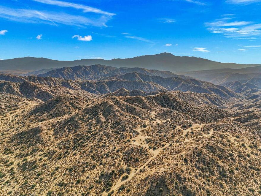 320 Acres of Prime Land in San Bernardino County - Secluded, Scenic & Surrounded by NatureLocation: Just South of Yucca Valley, CaliforniaParcel Size: 8 parcels, each 40 acres (total 320 acres)Property Features:Stunning Views: Enjoy breathtaking panoramic views of the Salton Sea and Palm Springs from the elevated land.Natural Beauty: The property is surrounded by the Joshua Tree National Forest and BLM Land, offering a peaceful, natural setting perfect for outdoor activities, privacy, or investment.Accessible & Remote: Located just a short drive from the growing town of Yucca Valley, yet far enough to offer complete seclusion and tranquility. Ideal for those looking to escape into nature, build a private retreat, or invest in real estate with vast future potential.Unique Opportunity: The 320 acres are divided into 8 separate 40-acre parcels, allowing for flexibility in use - whether as a large, single estate or subdivided into smaller lots.Ideal For:Building a luxurious estate with panoramic desert views.Outdoor enthusiasts looking for a secluded getaway.Investors seeking land near growing areas like Yucca Valley, Joshua Tree, and Palm Springs.Development opportunities (subject to zoning and permits).This is an exceptional chance to own a large tract of land with unparalleled views and direct access to the best that the Southern California desert has to offer. Act fast - properties like this don't come along often!