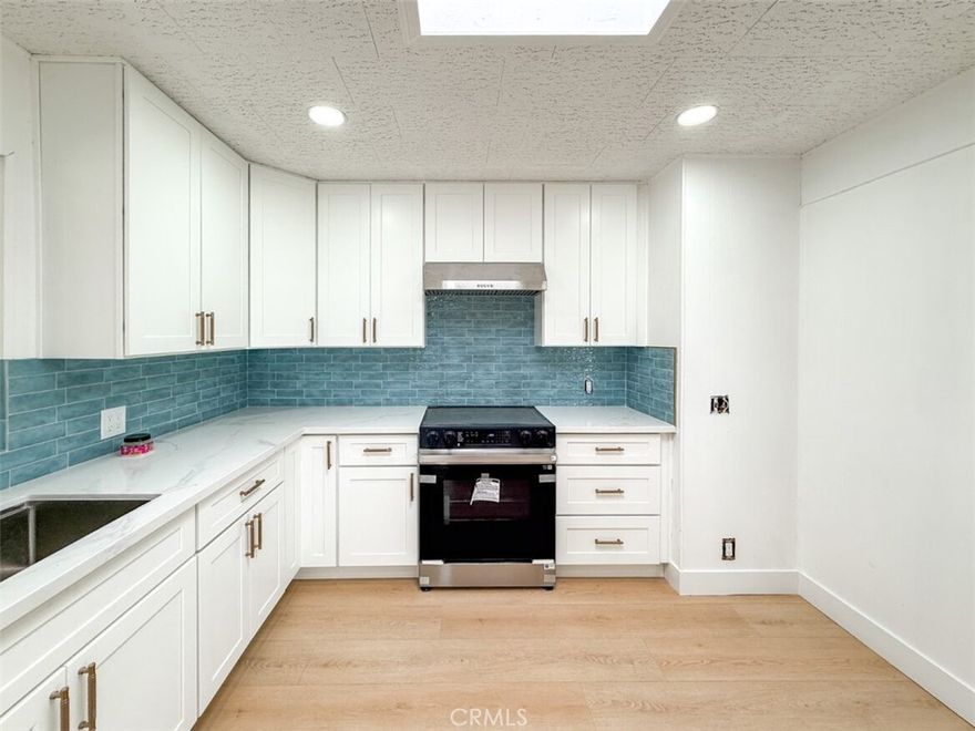 Welcome to this fully reimagined Spanish-style home in the highly desired Sierra Dawn Estates, a 55+ community that perfectly balances relaxation and active living. Behind its timeless stucco façade and arched lines, this residence has been completely renewed from top to bottom with thoughtful craftsmanship and modern comfort in mind.



The home features a brand-new flat roof, energy-efficient HVAC system, dual-pane windows, new PEX plumbing, new water heater, and LED recessed lighting throughout. Inside, fresh paint, wide-plank flooring, and abundant natural light create a warm, inviting flow. The open living and dining spaces lead to a stylishly remodeled kitchen that shines under a new skylight, showcasing quartz countertops, shaker cabinetry, stainless-steel appliances, a sky-blue tile backsplash, and brushed-gold hardware.



Both bathrooms have been tastefully redesigned with modern fixtures, updated vanities, and elegant tilework. The spacious bedroom includes its own skylight, filling the room with soft daylight and a serene ambiance. A dedicated laundry room and utility room add daily convenience, while a bonus 300-square-foot storage room provides incredible flexibility—ideal for conversion into a garage, workshop, or creative studio.



With its fresh renovations, quality systems, and timeless Spanish character, this house beautifully uplifts classic living. Just a short drive away, the stunning Diamond Valley Lake offers hiking trails, fishing and boating—bringing a natural escape to the doorstep of one of Hemet’s most welcoming active-adult communities.