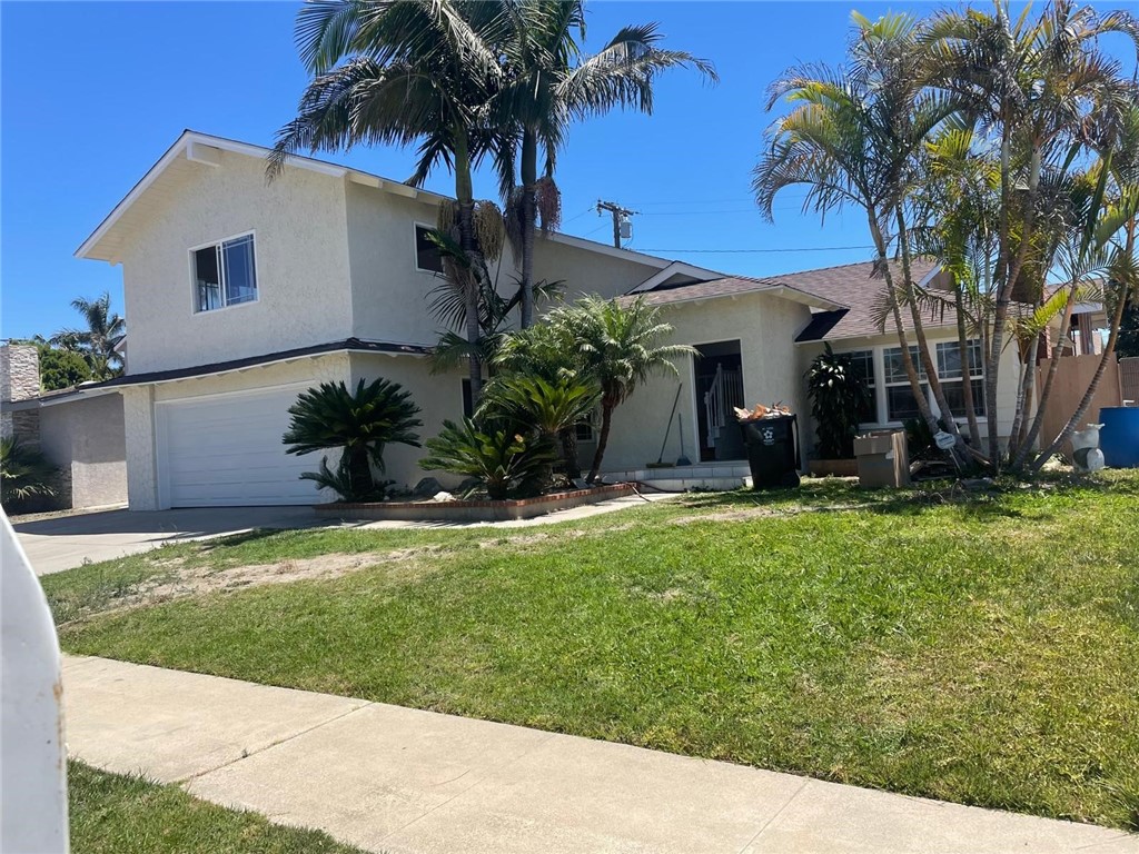 Welcome to this spacious 5-bedroom, 3-bathroom home in a quiet, family-friendly Huntington Beach neighborhood. Offering nearly 1,900 sq ft of living space, this home features bright and inviting living areas with a flexible floor plan—perfect for families, multigenerational living, or those needing dedicated space for work or guests. An attached 2-car garage provides convenient parking and storage. Situated within walking distance of well-regarded schools—Schroeder Elementary (7/10 GreatSchools), Helen Stacey Middle (8/10 GreatSchools), and Marina High (10/10 GreatSchools)—this location combines community appeal with solid academic offerings. Enjoy living in a peaceful, well-kept neighborhood with shopping, dining, parks nearby, and the beach just a short drive away. Please note: this rental is for the front unit (main house) only. The property includes a separate ADU that will be leased independently and is not included in this lease offer.