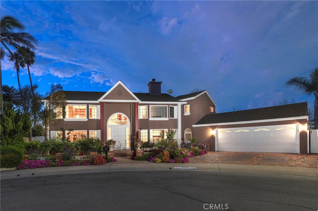 Perched high atop a serene cul-de-sac on Huntington Harbour’s coveted Gilbert Island, this elegant coastal retreat offers breathtaking channel views and the best of Southern California living.
Spanning nearly 4,400 square feet, the residence features four spacious bedrooms, including a main-floor suite ideal for guests or multi-generational living. Throughout the home, custom built-ins, rich wood floors, crown molding, and fine finishes create an atmosphere of timeless sophistication.
The gourmet kitchen overlooks a resort-style backyard—perfect for entertaining—with a sparkling pool and spa, built-in BBQ/bar, and lush tropical landscaping that captures the essence of a private paradise.
Upstairs, the primary suite is a true sanctuary with panoramic channel views, a cozy fireplace, spa-inspired bath, and dual walk-in closets. Two additional guest suites each offer private en-suite baths and generous closet space.
Enjoy cool ocean breezes and a lifestyle that blends luxury and leisure—walk or bike to Bolsa Chica Beach and Wetlands, or enjoy nearby dining, shopping, and entertainment just minutes away. A charming park and playground sit just steps from the front door.
This remarkable home combines coastal elegance, comfort, and convenience in one of Huntington Harbour’s most desirable enclaves.