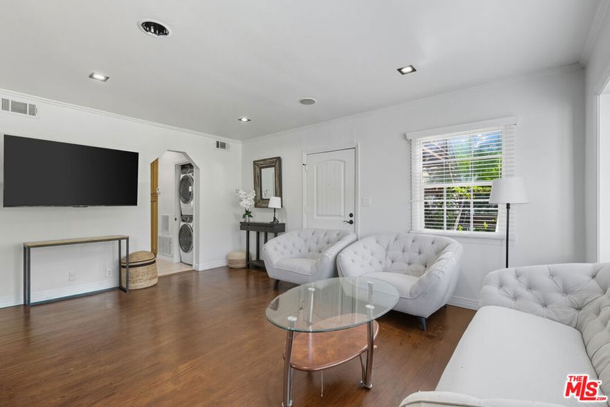 Welcome to this charming, fully furnished unit perfectly situated in the heart of the city! This spacious 1 bed, 1 bath gem is within minutes to everything. Enjoy an abundance of natural light through the large windows throughout. The fully equipped kitchen offers all you need for home cooking including stainless steel appliances, ample cabinetry, and a breakfast nook. The generously sized bedroom includes a nice closet and flat screen tv. Enjoy year round comfort with central heat and air, and for added convenience, there is a stacked washer and dryer, linen closets, storage space, and 1 gated assigned parking space. With stylish furnishings, thoughtful touches throughout, and an unbeatable location near major studios, the Hollywood Bowl, Runyon Canyon, Lake Hollywood Dog Park, Universal Studios, and easy access to the 101 freeway - this is an opportunity you won't want to miss!