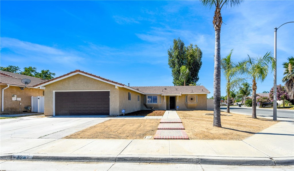 This beautifully revamped corner lot home is centrally located and close to shopping and movie theater. The home offers 3 ample size bedrooms with ceiling fans, walk in closets, new carpet and fresh paint, 2 updated bathrooms, one with tub and shower and the other shower only. Kitchen is bright with good amount of cupboard space. New quartz counter tops and stainless steel appliances, new recessed lighting and paint, it opens up to the living room and dining room which creates a nice gathering space. New landscaping in both front and back yards, 2 patio covers offer shade on hot days. Truly a must see.