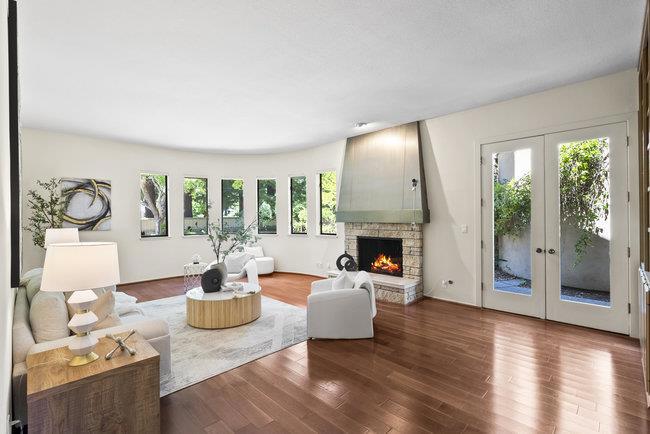 Embrace privacy, leisure, and sophisticated architectural style in this stunningly distinct 45-year-new home on 1.235 level acres in exclusive West Atherton. Framed by mature perimeter trees, this strikingly chic two-story home is defined throughout by high vaulted ceilings and sparkling views of the lush backyard with pool, hot tub, pool house, and tennis court. 5 bedrooms, 4.5 bathrooms, (a full bathroom in the pool house). Ground floor features grand entry with foyer, parlor with fireplace, private bedroom suite, remarkably spacious living room with fireplace and wet bar, family room with fireplace and bay window overlooking backyard, dining room with mirrored ceiling, and cozy breakfast nook. Second level features 4 bedrooms (including primary suite with skylight and two walk-in closets), plus a loft open office with fireplace. Attached 3-car garage, new roof, new exterior paint. Proximity to Stanford University and tech destinations. With its sought-after location, abundant flat acreage, and one-of-a-kind architectural design, this sweeping green estate is the perfect canvas for your vision of exquisite living. Square footage breakdown: Main house approximately 6,275 sq. ft. plus 3-car garage 875 sq.ft. pool changing room 160 sq.ft. storage 285 sq.ft. Buyer to verify.