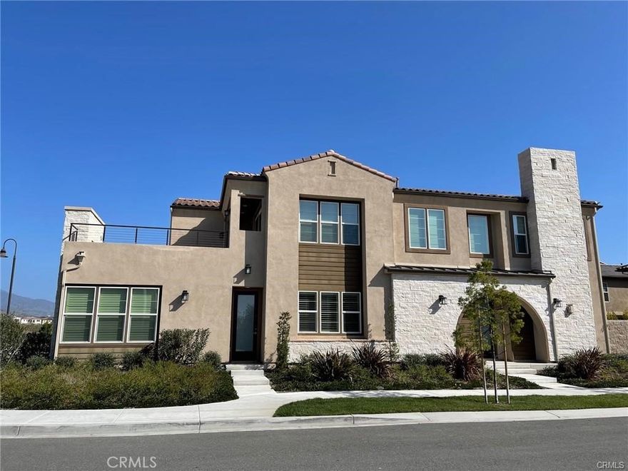 This luxurious residence is Altair’s most beautiful and upgraded home in the "Aurora neighborhood " and it can now be yours. Set inside the Altair Irvine guard-gated master plan, this very bright and airy two-story home includes an attached private suite with a separate entrance, living room, bedroom, bathroom, kitchenette, and laundry area. The main home provides four bedrooms, four full-sized bathrooms, and one-half bathroom in total, along with enviable design details such as a modern layout, an upper loft with a large open deck and fireplace, walk-in closets in every bedroom, and a luxurious master suite. A private corner location and home automation technology at your fingertips. Association amenities include clubhouse, pools, Spa, parks, BBQ, play zone. Much more wonderfulness and excellence of quality lifestyle coveted hidden in this luxury-living Altair home! Walking distance to awarded school district with 10 score Portola high school .
