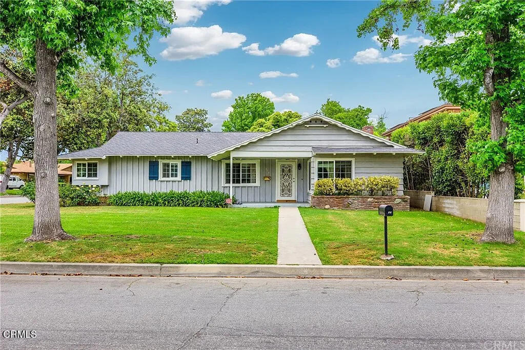 Located in a peaceful, tree-lined neighborhood within the award-winning Arcadia School District, this charming 3 bedroom, 2 bath home is perfect for comfortable family living. Step inside to a spacious living room and dining area that flow into the inviting family room, complete with a cozy fireplace. The family room opens to a large backyard and patio- just right for outdoor gatherings, playtime, or simply relaxing.The bright, updated kitchen overlooks the family room, making it easy to stay connected while cooking or entertaining. The primary suite features its own ensuite bathroom, while two additional bedrooms and a full bath are tucked away for privacy.Conveniently located near the schools, parks, shops, and restaurants.