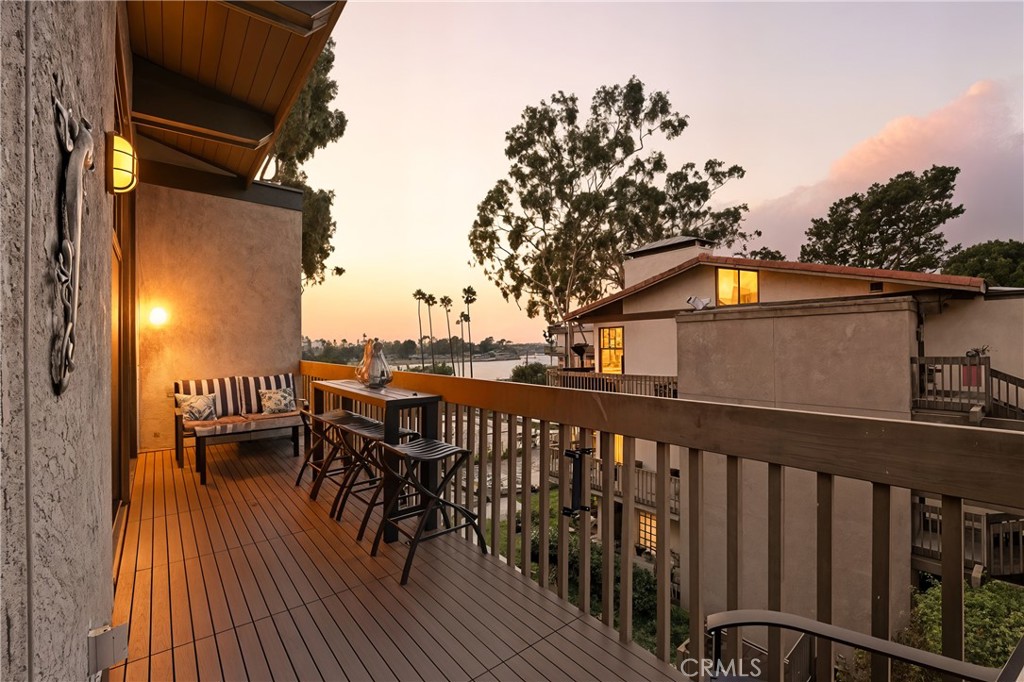 Sophisticated and extensively remodeled, this one-bedroom plus den residence at 7327 Marina Pacifica Dr S offers impeccable style, comfort, and beautifully designed living spaces. Featuring vaulted, beamed ceilings and abundant natural light, this thoughtfully renovated home feels both open and inviting. From the private balcony, enjoy serene views of the lagoon and Alamitos Bay — the perfect spot to unwind and take in the coastal ambiance. Every detail has been elevated, from the custom cabinetry and built-ins to the elegant flooring and redesigned bath.
Enjoy resort-style amenities including six pools, three spas, a fitness center, and a clubhouse — all within this 24-hour guard-gated waterfront community. Just across the private footbridge, you’ll find convenient shopping, dining, and fitness options, while 2nd & PCH is right across the street with fine dining, boutiques, and Whole Foods. Nearby Naples Island and Seal Beach add to the vibrant coastal lifestyle that makes Marina Pacifica one of Long Beach’s most desirable addresses. With approximately 1,012 square feet of well-planned living space and two assigned subterranean parking spaces, 7327 Marina Pacifica Dr S perfectly combines sophistication and coastal ease in an exceptional waterfront setting.
