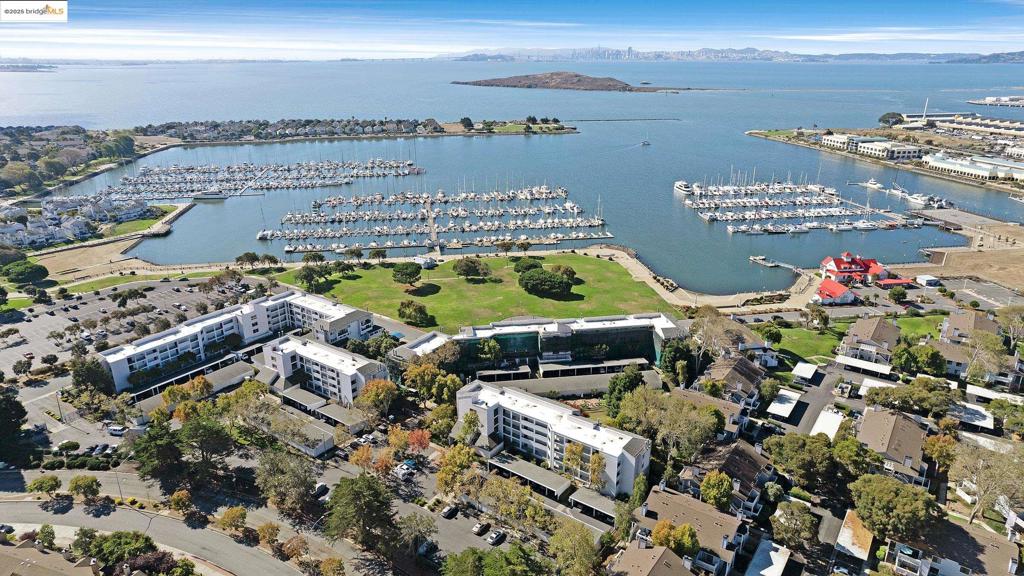 Enjoy gorgeous San Francisco and Marina Bay Views from south facing windows and 2 covered balconies. Directly across from the Bay Trail, nearby restaurants, shops and the Ferry. This freshly painted and updated 2 story, 2 bed/2-1/2 bath, townhouse style condo in the Marina Bay is waiting for you! Easy access to the East Bay, Marin and San Francisco. Beautifully remodeled kitchen with lots of cabinets and counter space. Wood floors in kitchen, living and dining area. Two large bedrooms with fully remodeled full ensuite bathrooms. Custom shutters on all windows. This is the largest unit style in the Northshore complex. Unit comes with one deeded covered carport with storage and potential for a charging station, and one additional uncovered parking space in this lovely, gated community. Don't miss this hidden gem! OPEN HOUSE 4/7 and 4/14 from 2-4pm Accepting offers on 4/17 by 3pm