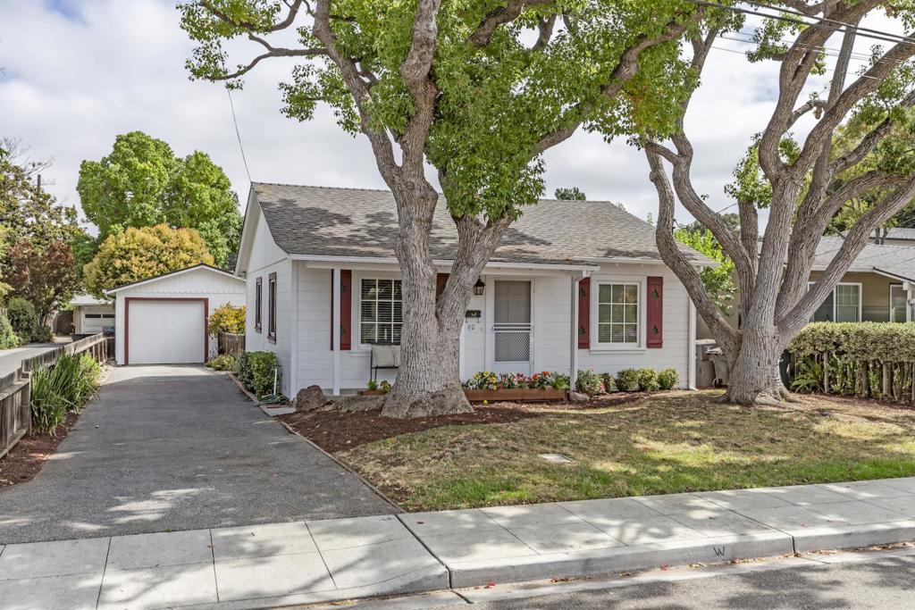 Perfectly located in Old Mountain View less than one mile from vibrant Castro Street shops and restaurants, this charming home boasts classic curb appeal, gorgeous hardwood floors, and an ideal single-level floor plan. From the crisp white exterior, to the neutral interior color palette, this home has been thoughtfully updated and is entirely move-in ready. The living room sits at the front of the home and opens directly to the kitchen with granite countertops and a dining area. A light-filled bedroom boasts two large windows, offering views of both the front and side yards. The spacious primary bedroom sits privately at the back of the home and includes three closets, one of which is a generous walk-in. Outdoors, the fully-fenced yard is home to productive fruit trees, room for a vegetable garden, and a covered patio perfect for alfresco dining. The detached garage provides a workbench and ample storage and workshop space, with the potential to transform into an office or exercise room. A lovely home that is ready to be enjoyed entirely as is, or can be easily remodeled or customized to fit your needs. Just steps from downtown amenities, the transit center, acclaimed schools, and moments to major tech employers and commute routes.