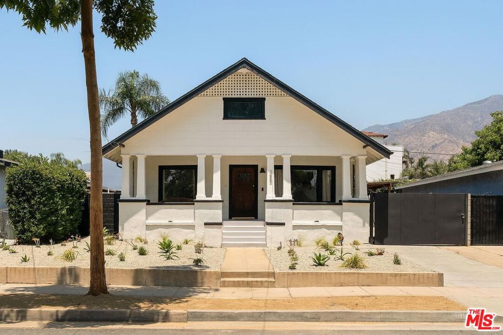 A 1912 classic, reimagined for today, and looking hotsy-totsy 100 years later! Perched proudly on a wide Pasadena street, this 2-bedroom California Craftsman-Colonial mashup is a timeless beauty born during the city's golden age of rose parades, red car trolleys, and hand-hewn architecture. Thoughtfully updated in 2022, it seamlessly blends historic soul with modern ease. A stately front porch, original wood door, and signature cylinder glass windows set a warm, elevated tone. Inside, the living room welcomes you with fresh paint, engineered hardwood floors, updated lighting, and a decorative fireplace that nods to the past while setting the stage for cozy gatherings. Just beyond, the sun-splashed parlor offers the ideal flex space perfect for working from home or curling up with a book. The spacious dining room flows into an open-concept kitchen, ready for weeknight dinners or dinner parties alike. Down the hall, you'll find two generous bedrooms, each drenched in natural light and offering deep closets. The bathroom has been tastefully renovated with a clean, classic aesthetic that respects the home's heritage. A spacious laundry/mudroom offers additional storage, and the large attic and California cellar are brimming with potential. Outside, the 6,991 sq ft lot offers low-maintenance landscaping and plenty of room to grow. Just minutes from Altadena, Christmas Tree Lane, Homestate Tacos, Highlight Coffee, and the charm of Old Town Pasadena. History, style, and location all in one. Welcome home!