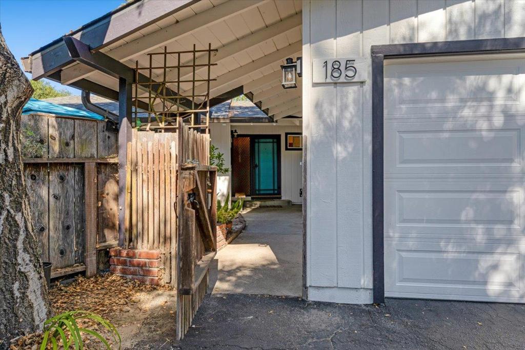Welcome to 185 Woodston Way A Mid-Century Gem in the Mountains Tucked into a quiet neighborhood just minutes from downtown Ben Lomond, this mid-century beauty blends classic charm with thoughtful updates. Check out the vaulted exposed wood ceilings. Soak up the sunshine in the fully gated front and back yards. perfect for gardening, pets, or just enjoying your own private oasis. Fresh mountain air and sweeping valley views set the stage for peaceful twilight walks. Recent updates including: a new roof (2023), gutters (2022), windows (2021), water heater (2019), septic system (2022), and freshly paved roads as of July 2025. The kitchen features a new refrigerator (2021) and oven (2024), making it move-in ready for your culinary adventures. Dont miss the versatile 100 sq ft bonus room with electricityideal for a home office, creative studio, or cozy guest space. The attached two-car garage and generous driveway provide parking for up to four vehicles. Plus, youll love having natural gas serviceno propane required! With no HOA, just sunny days, peaceful living, and plenty of room to plant your roots, 185 Woodston Way offers the perfect blend of privacy, charm, and convenience. Buyer to verify square footage, bed/bath count, and permit history. Some photos have virtual staging.