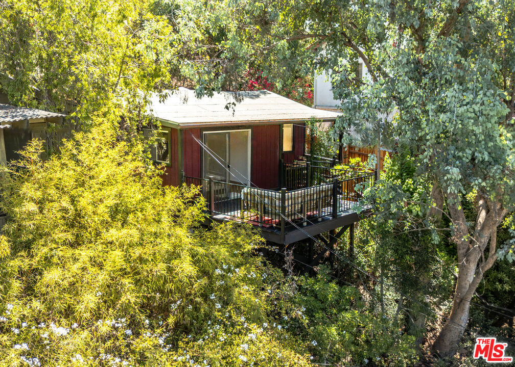 You start at the sidewalk, follow the steps upward, and feel the air shift. The noise fades, the trees open, and there it is a private perch high above the street, like a crow's nest with wide-open views. From the deck, you have a front-row seat to sunrise, sunset, and everything in between.Public records show 1 bedroom, yet there's a second large room that could easily serve as a bedroom, office, or creative studio. This 1-bath retreat blends charm and comfort, with an open kitchen anchored by a generous island that makes cooking and entertaining effortless. The space flows naturally into the light-filled living area, creating an easy rhythm between gathering and unwinding.Off one of the rooms, a large wooden deck invites lazy mornings with coffee or starry-night conversations, while a welcoming front porch offers another peaceful spot to take in the hillside air. From the kitchen, step out to a garden hideaway perfect for al fresco dining, lounging, or simply soaking in the hush of nature.Secluded yet central, you're just moments from the Metro Line, local favorites, and within the highly sought-after Mt. Washington Elementary School district. A hillside retreat where privacy, connection, and the occasional visiting crow remind you just how special this perch really is.