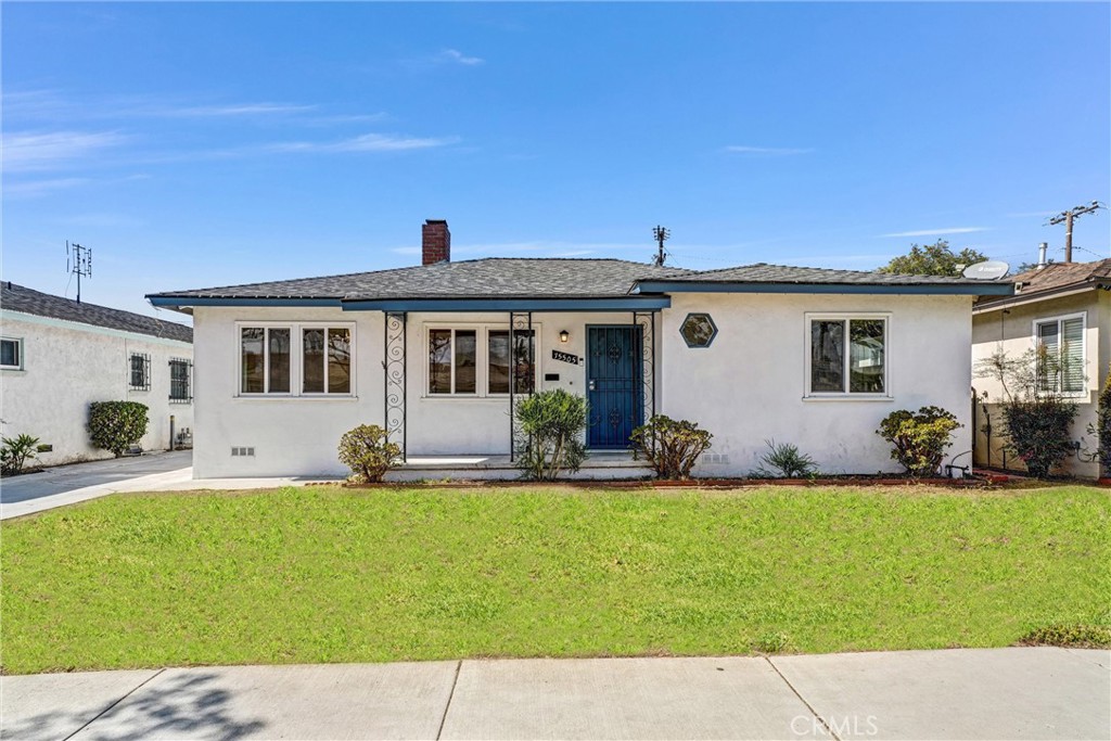 Welcome to 15505 Van Buren Avenue, a charming 3-bedroom, 2-bath home offering 1,335 square feet of comfortable living space in a quiet Gardena neighborhood. Freshly updated and filled with natural light, this inviting home blends classic warmth with modern touches. The spacious living room features recessed lighting, beautiful hardwood floors, and a brick fireplace that sets a cozy tone for gatherings. Just off the living area, the dining room offers an elegant space for shared meals and flows seamlessly into the bright kitchen, which provides plenty of cabinet and counter space. Each of the three bedrooms is light and airy, offering flexibility for guest rooms, a home office, or creative use. Both bathrooms have been tastefully updated, featuring modern fixtures and clean finishes that complement the home’s timeless character. Outside, a long driveway leads to gated parking and a backyard area with plenty of potential for outdoor entertaining or gardening. With its fresh paint, stylish updates, and convenient location near shops, dining, parks, and major freeways, this home is move-in ready and full of opportunity to make it your own.