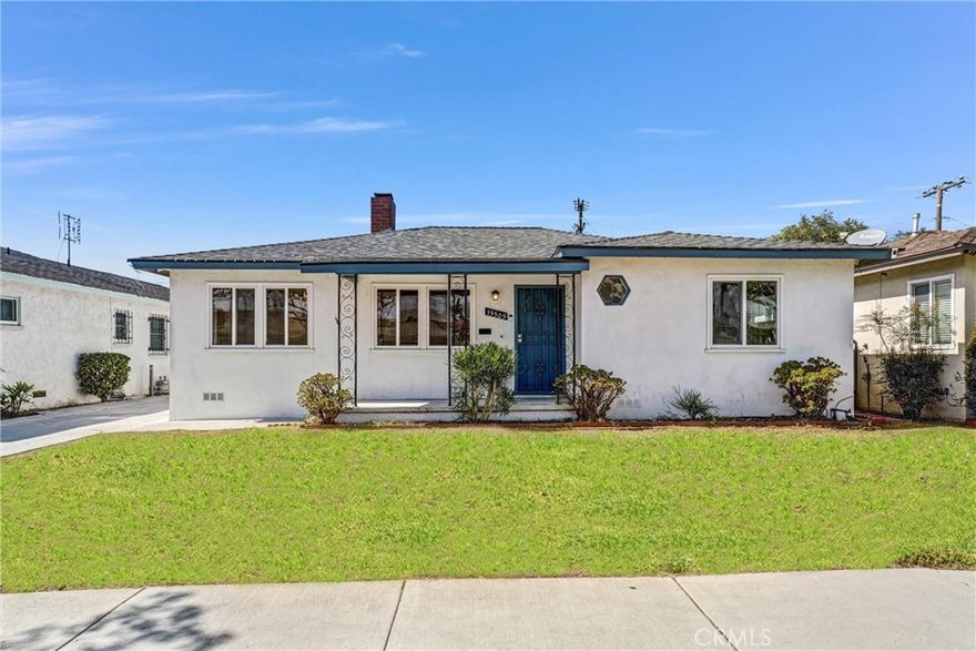 Welcome to 15505 Van Buren Avenue, a charming 3-bedroom, 2-bath home offering 1,335 square feet of comfortable living space in a quiet Gardena neighborhood. Freshly updated and filled with natural light, this inviting home blends classic warmth with modern touches. The spacious living room features recessed lighting, beautiful hardwood floors, and a brick fireplace that sets a cozy tone for gatherings. Just off the living area, the dining room offers an elegant space for shared meals and flows seamlessly into the bright kitchen, which provides plenty of cabinet and counter space. Each of the three bedrooms is light and airy, offering flexibility for guest rooms, a home office, or creative use. Both bathrooms have been tastefully updated, featuring modern fixtures and clean finishes that complement the home’s timeless character. Outside, a long driveway leads to gated parking and a backyard area with plenty of potential for outdoor entertaining or gardening. With its fresh paint, stylish updates, and convenient location near shops, dining, parks, and major freeways, this home is move-in ready and full of opportunity to make it your own.