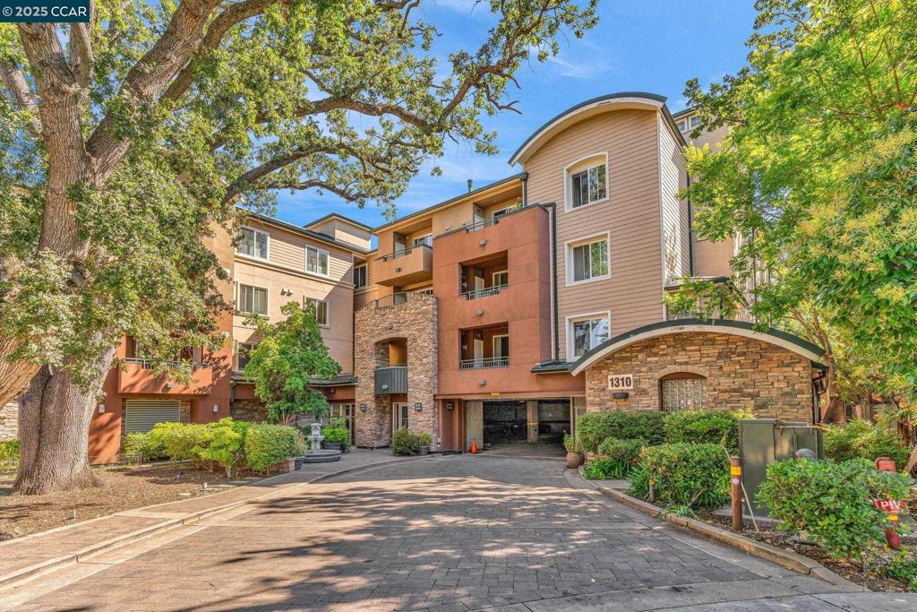 Rare opportunity to own a modern condo in a serene comfortable and convenient newer building in Walnut creek. Excellent Location, Perfect condition, open & airy floor plan, Largest unit in the building on the top floor with no one above you. Offering almost 1700 sq. ft., 2 bedrooms Plus Bonus room / 3rd bedroom and office space, 2 baths, 2 garage spaces, Full size washer and dryer, Spacious Living room & Dining room with cozy gas fireplace. Gourmet Kitchen with granite counter, gas stove, refrigerator and breakfast bar. Private patio with storage area and view of the beautiful Oak trees. This beautiful community offers secure garage parking, elevator, workout room, and bike cage. Perfectly located within minutes from Iron Horse Trail, close to Downtown, premier shopping, restaurants, Kaiser hospital, Bart station and 680/24 HWY HOA of only $532/Month Water & Garbage are included.