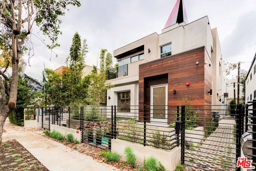 Newer modern building in heart of West Hollywood. Stunning 2 bedroom, 2.5 bath townhome-style. First floor is dining & living room, pocket door windows opens to a large private patio that creates a great flow of indoor/outdoor . designer kitchen with European appliances & Italian cabinets. Powder room for the guests. Upstairs there are 2 bedroom suites with floor to ceiling custom closets, designer bathroom with oversized shower, seamless glass enclosure, double sink, porcelain tile. Other features: 3rdfloor : Large private roof deck great for a Zen private sundeck. Recessed lighting throughout, wood flooring, laundry in unit , storage area. Parking: In addition the secure gate each unit has a second gated private garage for 2 cars with direct access to the unit. One Garage is approximately 300 SQFT and equipped with epoxy flooring, internet, TV connection, and folding doors. Close distance to best area of West Hollywood, restaurants, high-end designer boutiques, PDC and the Grove. Unit is available to show .