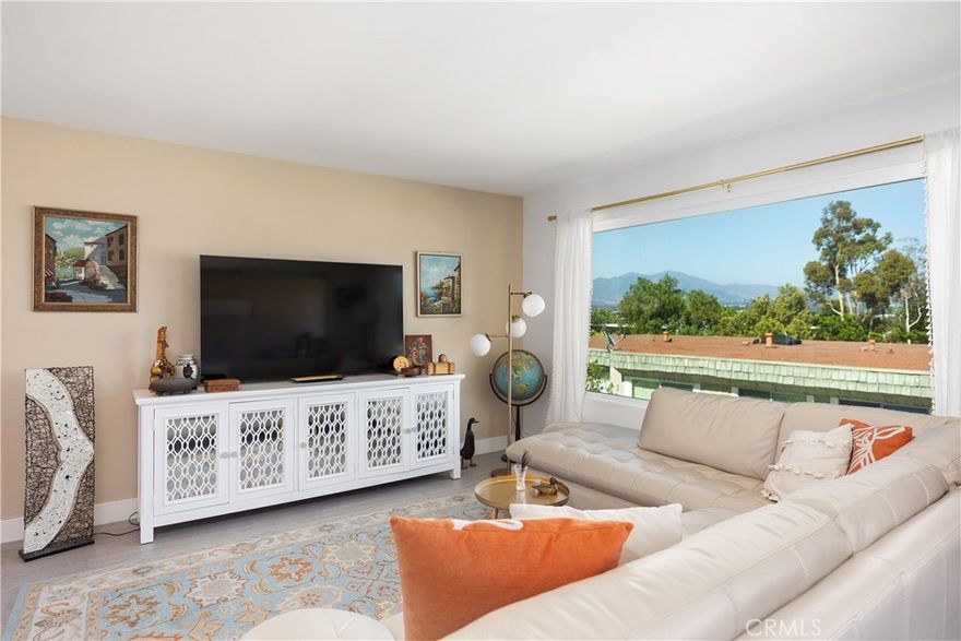 Spectacular City Light & Mountain Views | Stylishly Renovated End Unit in Laguna Hills
Welcome to Laguna Hills – a hidden gem in the heart of Orange County, just moments from Laguna Beach and surrounded by the natural beauty of Laguna Canyon. This end unit offers stunning mountain views and sparkling evening city lights, creating a serene, picturesque backdrop to your everyday life. Recently and meticulously renovated, this bright and airy 2-bedroom home features a modern, open-concept layout with seamless indoor-outdoor living. Step into a spacious living and dining area flooded with natural light, and relax on your private balcony while taking in the panoramic cityscape after sunset.  Designed with comfort and style in mind, the home boasts fresh paint, new waterproof vinyl plank flooring, upgraded baseboards, and a fully remodeled kitchen featuring quartz countertops, designer tile backsplash, and nearly-new stainless steel appliances. The upstairs bathroom is remodeled with new cabinetry and sink.  Downstairs, both bedrooms offer privacy and cozy comfort, complete with ample closet space, updated bathroom with a sleek glass sink countertop, new toilets, and additional storage under the stairs. Unique to this unit is a flexible private carport area that can double as a garden courtyard or peaceful outdoor retreat—perfect for customizing your lifestyle. You’ll also enjoy the convenience of direct-access one-car garage parking, a newer washer and dryer, and optional EV charger capability. New HVAC system at a cost os $15k.
Located in the resort-style community of Laguna Village, this home includes access to an impressive array of HOA amenities: pools, spa, fitness center, tennis, basketball and volleyball courts, and more. Unique to this unit is a flexible private carport area that can double as a garden courtyard or peaceful outdoor retreat—perfect for customizing your lifestyle. You’ll also enjoy the convenience of direct-access one-car garage parking, a newer washer and dryer, and optional EV charger capability.