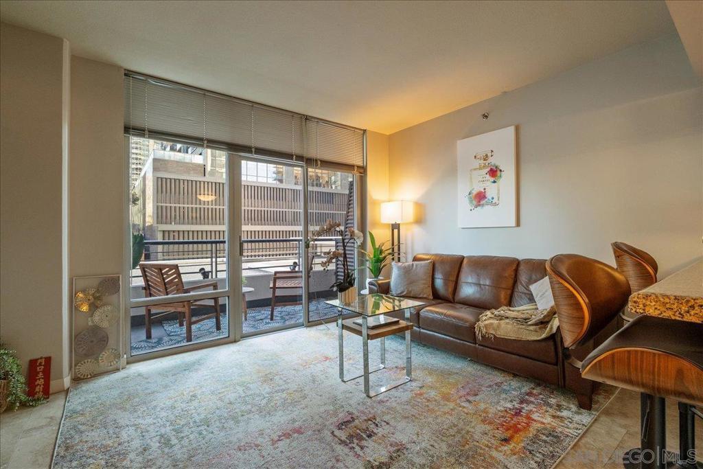 Discover your urban oasis in the heart of Little Italy! This stylish 2-bedroom, 1-bathroom condo offers 873 square feet of thoughtfully designed living space. The unit is part of the Acqua Vista building, renowned for its contemporary amenities and prime location. Upon entering, you're greeted by an open layout that seamlessly blends comfort and functionality. The living area is enhanced with natural light and features a balcony, providing a perfect spot for enjoying the outdoors and city views. The kitchen includes brand new stainless steel appliances. Unit has A/C and an in-unit laundry with washer and dryer for convenience. Acqua Vista offers resort-style amenities, including a 24/7 concierge service, valet parking, a rooftop pool and spa, a BBQ area, Amazon lockers, and a well-equipped fitness center. The building also boasts a secure environment with a comprehensive security system. The condo includes one valet parking spot. Live steps from the Little Italy Farmers Market, renowned restaurants, craft coffee shops, boutique shopping, and the San Diego Bay. You’re a short walk from Portside Pier (9 mins). Close to Seaport Village and the iconic Rady Shell. Close to public transportation and trolley conveniently located just a few blocks away.